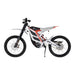White and red electric dirt bike with knobby tires on a white background.