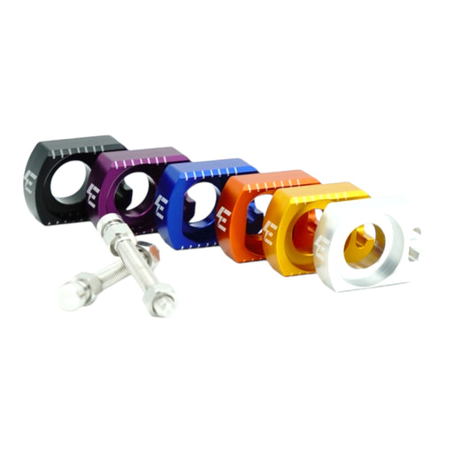 Anodized motorcycle chain adjuster blocks in black, purple, blue, orange, gold, silver