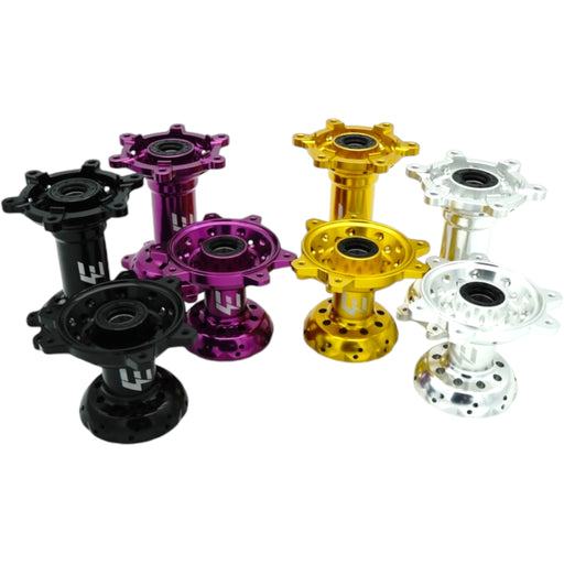 Anodized motorcycle wheel hubs in black, purple, gold, and silver colors