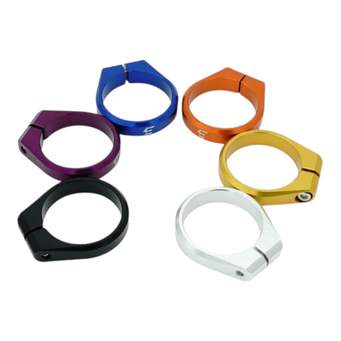 Set of six colorful metal clamps in black, purple, blue, orange, gold, and silver