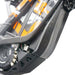 Electric bike mid-frame battery and motor close-up, black and orange e-bike components