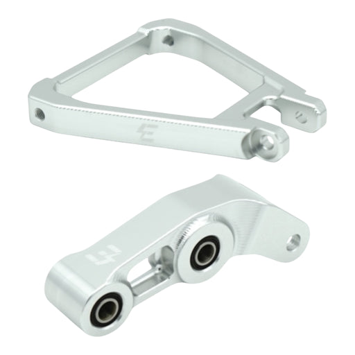 Silver aluminum motorcycle suspension linkage parts with bearings on white background