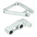 Silver aluminum motorcycle suspension linkage parts with bearings on white background