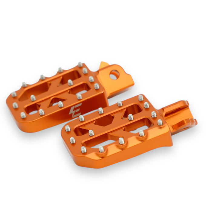 Orange anodized CNC alloy motorcycle foot pegs with removable traction pins