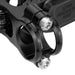 Black handlebar clamp close-up with bolts and textured brake fluid reservoir text