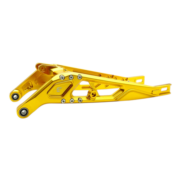 Gold-colored metal motorcycle swingarm with bolts and mounting points