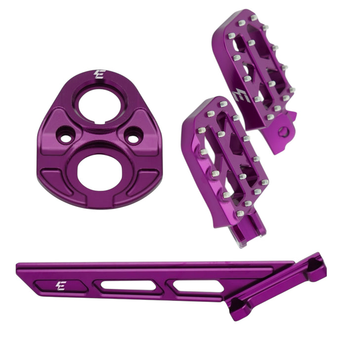 Purple anodized motorcycle footpegs and mounting kit with anti-slip pins