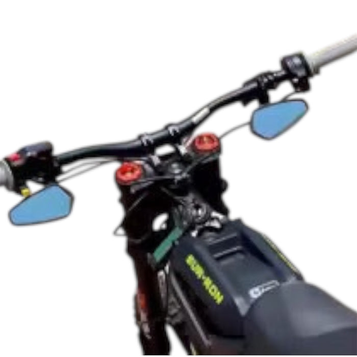 Dirt bike handlebar view with mirrors, grips, and top triple clamp