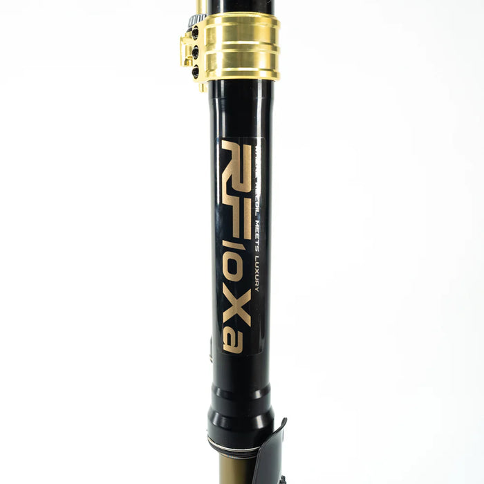 Black and gold RFloxa branded motorcycle fork tube with clamp on white background.