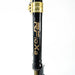 Black and gold RFloxa branded motorcycle fork tube with clamp on white background.
