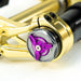 Gold motorcycle suspension component with a purple Recoil adjustment knob.