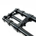 Black mountain bike suspension fork lowers with triple clamp on white background.