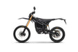 Black Komodo L3 electric dirt bike side view with gold forks and knobby tires