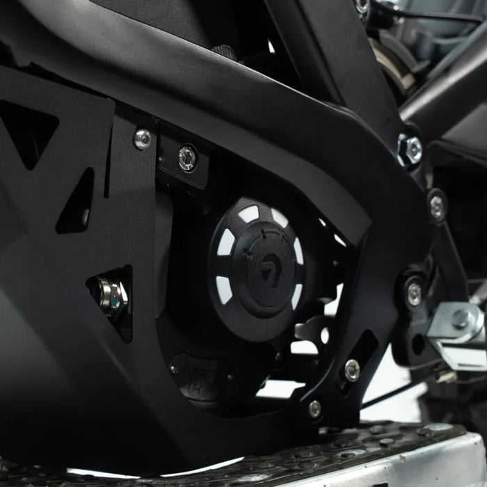 Electric scooter motor cover close-up, black plastic protective casing