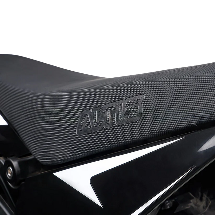 Close-up of textured ALTUS black scooter seat cover embossed logo